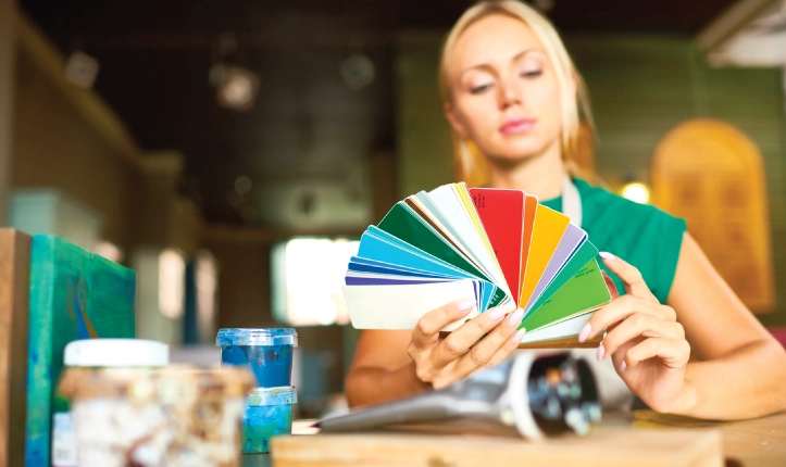 Women looking at label colors.