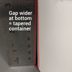 Gap wider at bottom, tapered container
